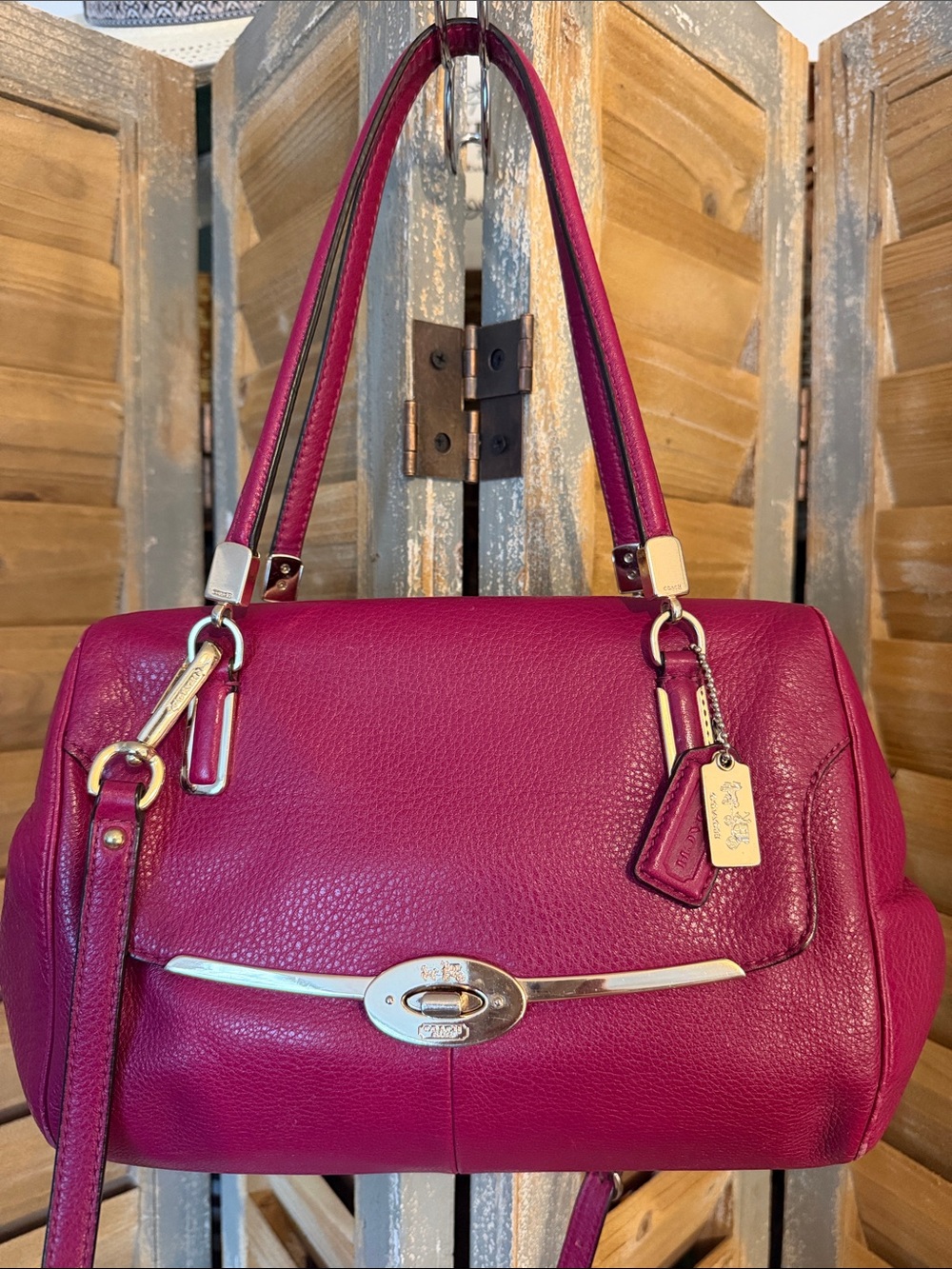 Coach Pebbled Fuchsia Leather Shoulder Bag with leather adjustable strap